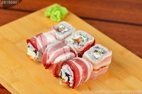 Image of Sushi roll with bacon