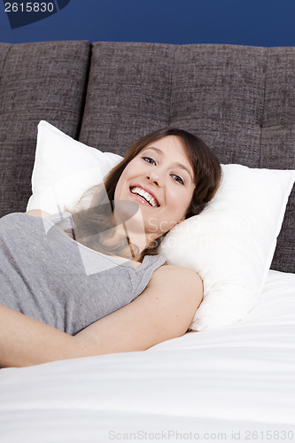 Image of Happy girl in the bed