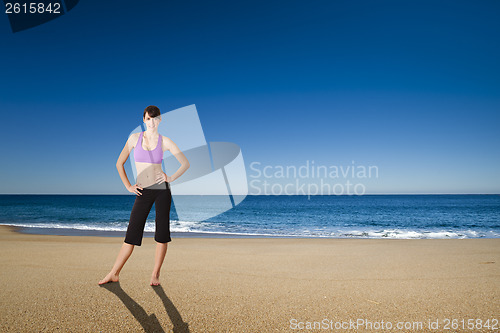 Image of Athletic woman in the beach