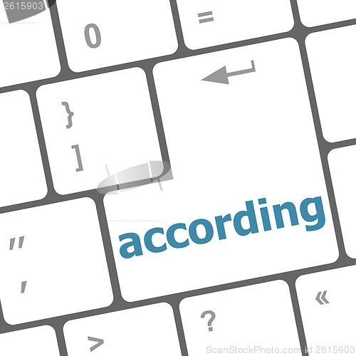 Image of according on computer keyboard key enter button