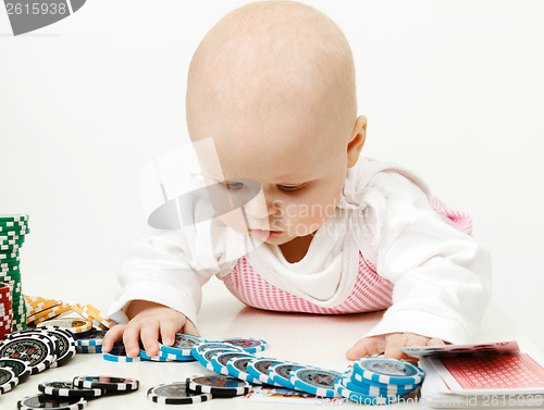 Image of baby playing with chips