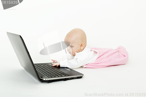 Image of baby with laptop