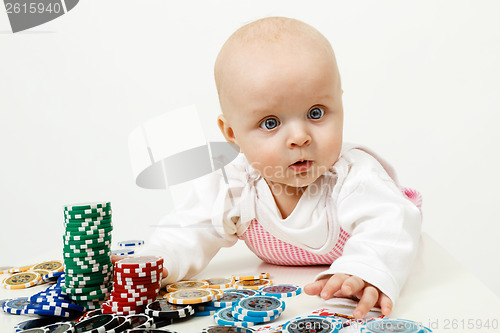 Image of baby playing with chips