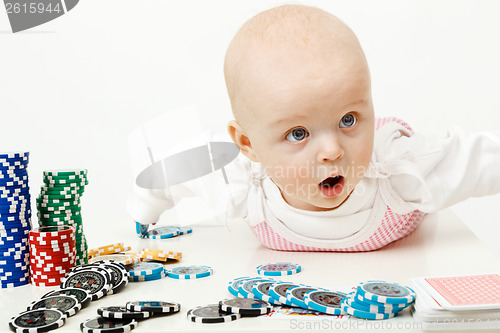 Image of baby playing with chips