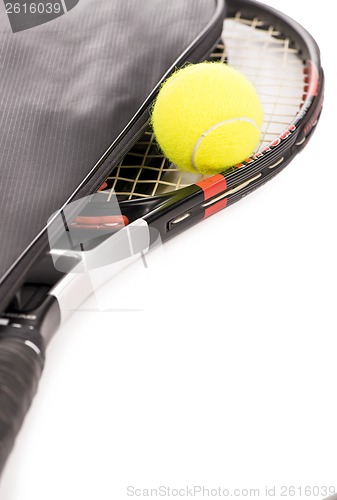 Image of tennis ball and racket on a white background