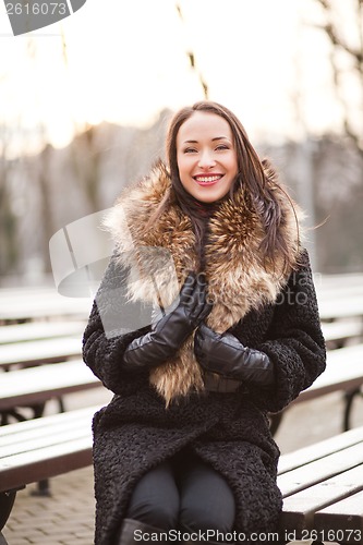 Image of Business woman laughing in the park