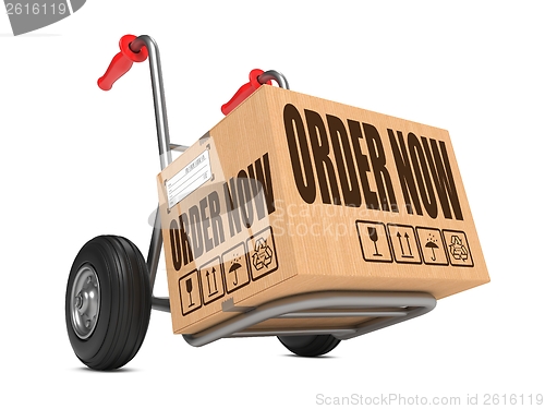 Image of Order Now - Cardboard Box on Hand Truck.