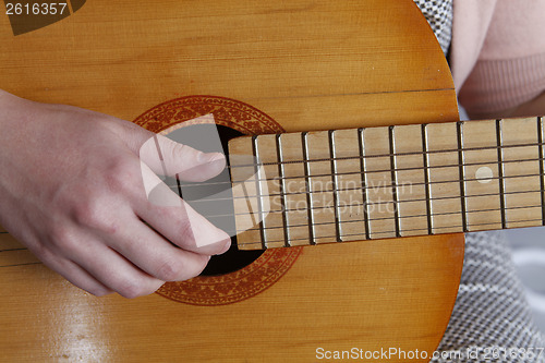 Image of Playing the guitar