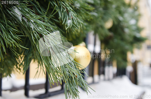 Image of Christmas fir tree decorated with balloons and is sprinkled with
