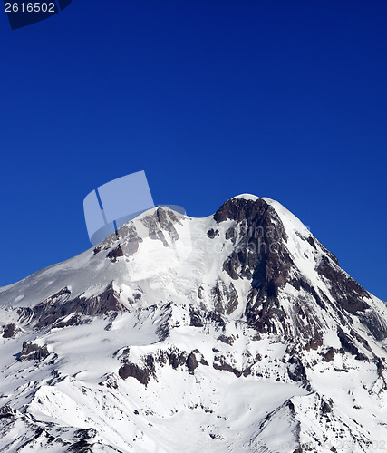 Image of Top of Mount Kazbek at sun winter day