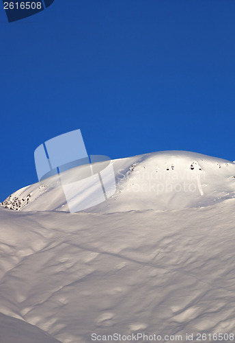 Image of Off-piste slope and blue cloudless sky in nice winter morning