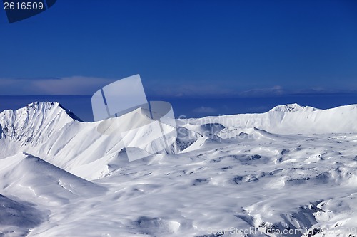 Image of Snowy plateau at sunny day and blue sky