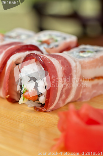 Image of Sushi roll with bacon