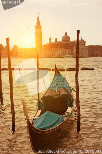 Image of Sunset view of Venice with gondola on Grand Canal