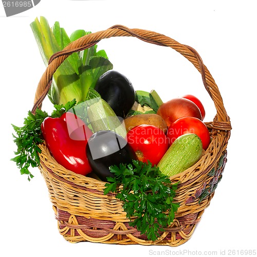 Image of basket with vegetables isolated on white 