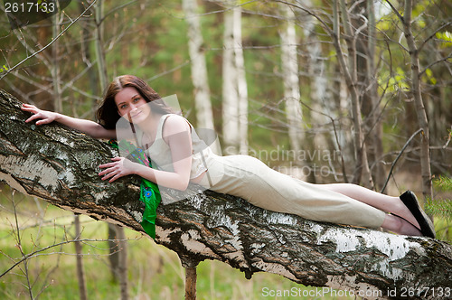 Image of Beautiful woman on birch