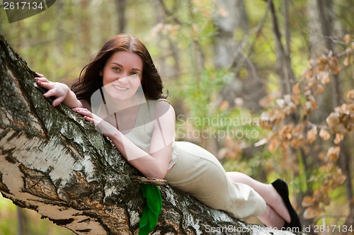 Image of Beautiful woman on birch