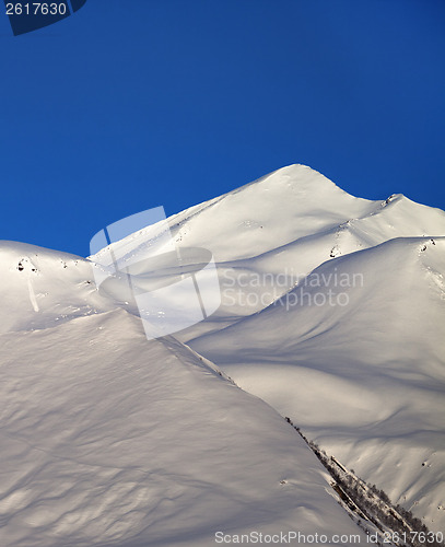 Image of Off-piste slope and blue clear sky in nice winter morning