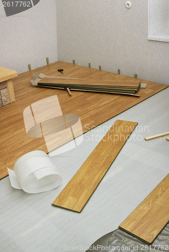 Image of Laying  laminated panels the color of the wood