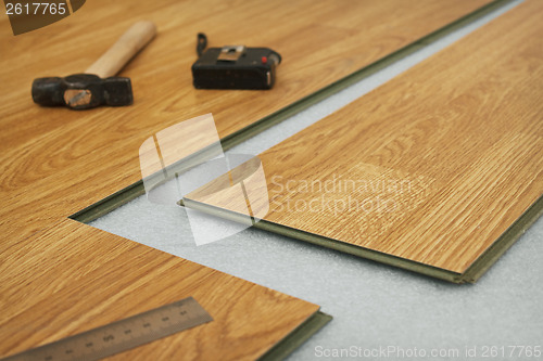 Image of Laying  laminated panels the color of the wood