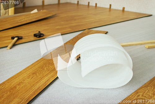 Image of Laying  laminated panels the color of the wood