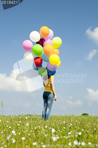 Image of Girl with colorful balloons