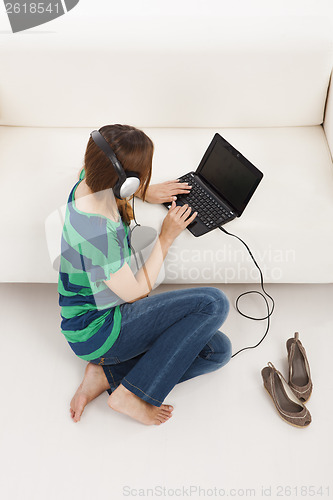 Image of Listen music and using  a laptop