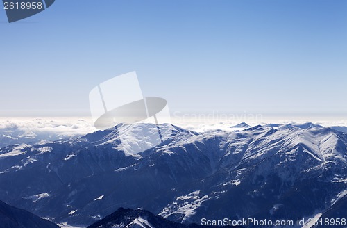 Image of Snowy mountains in morning haze