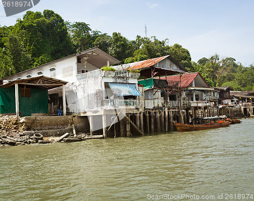 Image of Old houses on river bank. Thailand