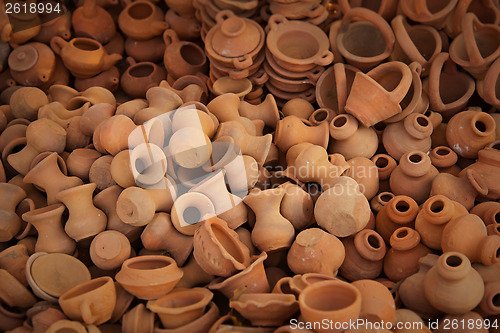 Image of Big pile of clay pots on the market