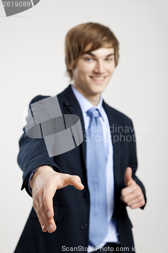 Image of Businessman giving a handshake