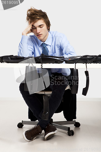 Image of Tired man in the office