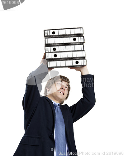 Image of Business man carrying folders