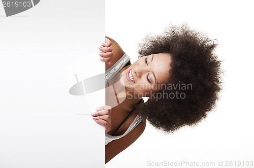 Image of Woman holding a white billboard