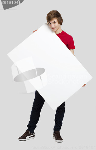 Image of Man holding a cardboard