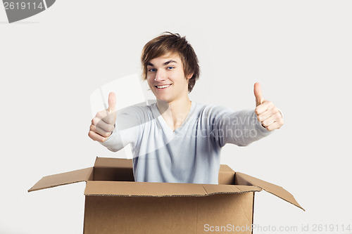 Image of Man inside a card box