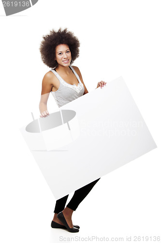 Image of Woman holding a white billboard