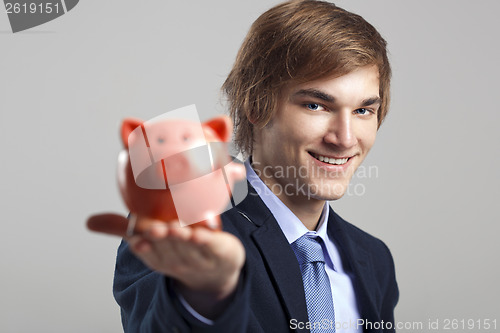 Image of Holding a piggy bank