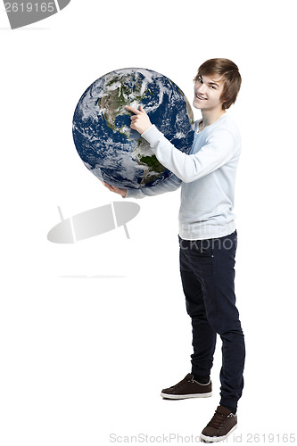Image of Holding and pointing to a planet earth