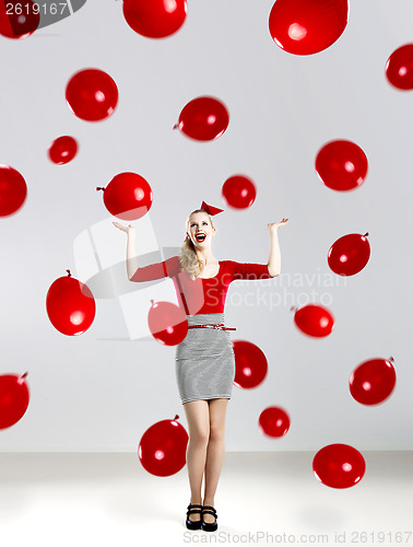 Image of Woman with red ballons
