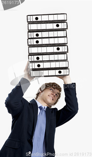 Image of Business man carrying folders