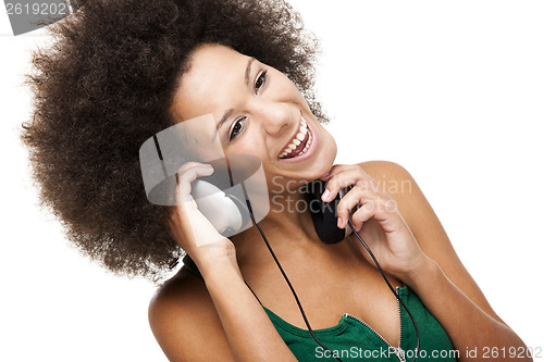 Image of Happy woman listen music