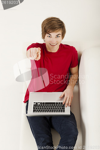 Image of Young man with a laptop