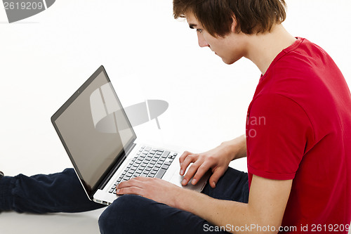 Image of Man working with a laptop