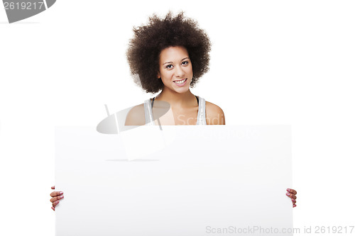 Image of Woman holding a white billboard