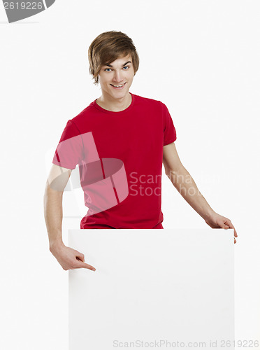 Image of Man holding a cardboard