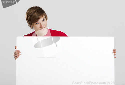 Image of Man holding a cardboard