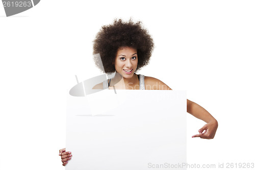 Image of Woman holding a white billboard