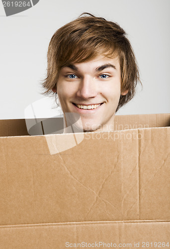 Image of Man inside a card box