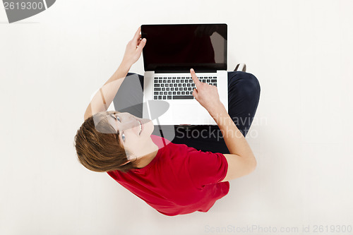Image of Man working with a laptop